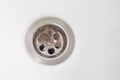 Top view. Clogging of the drain due to loose hair. A bundle of hair is obstructing the sink drain. The problem of hair Royalty Free Stock Photo