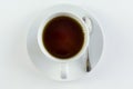 Top view close up of a cup of black tea, on white table Royalty Free Stock Photo