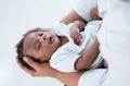 Top view of Close-up of cute African american newborn infant baby sleep in mother's hand at hospital. Healthcare medical. Royalty Free Stock Photo