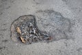 Top view, close-up, damaged cement road, bumpy ground.