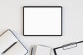 Top view and close up of empty white tablet on desktop with supplies. Work place and stationery objects concept. Mock up, 3D