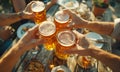 Top view Close-up of hands clinking beer mugs on wooden table with snacks outdoors, capturing cheerful toast among friends. Image Royalty Free Stock Photo