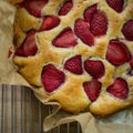 Top view close-up of a homemade strawberry cheesecake.