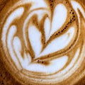 Top view close up image of cup of coffee with creative milk decoration Royalty Free Stock Photo