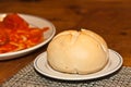 Lunch of freshly baked roll and suffed roasted peppers and sauce at a winery tasting event Royalty Free Stock Photo