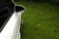 Top view and close up outside mirror of white car. Royalty Free Stock Photo