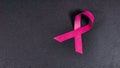 Top view, close up. Pink ribbon like a symbol of Breast Cancer Awareness. Royalty Free Stock Photo