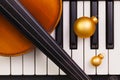 Top view close up shot of piano keyboard,old violin and Christmas decoration. Royalty Free Stock Photo