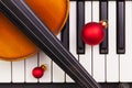 Top view close up shot of piano keyboard,old violin and Christmas decoration. Royalty Free Stock Photo