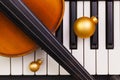 Top view close up shot of piano keyboard,old violin and Christmas decoration. Royalty Free Stock Photo