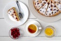 Top view close-up of sliced cherry pie, slice of pie on a plate and lemon tea Royalty Free Stock Photo