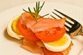 Sliced hard boiled egg, smoked salmon and sliced tomato strata Royalty Free Stock Photo
