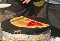 Top view of a vender preparing a strawberry crepe