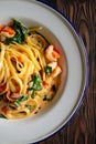 Appetizing shrimp pasta noodles with creamy sauce