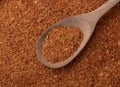 Top view, closeup of cayene pepper on a spoon. Food backdrop