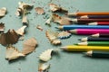 Closeup of shavings and coloring pencils on the blue desk