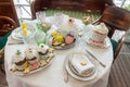 Top view closeup easter table setting sweet baked pastry on tableware white tablecloth with silverware Royalty Free Stock Photo
