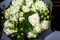 Top view closeup elegant bouquet of big white roses and fresh greenery Royalty Free Stock Photo
