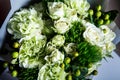 Top view closeup exquisite bouquet of big white roses and fresh greenery Royalty Free Stock Photo