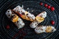 top view closeup four delicious eclairs with white topping