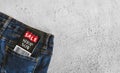 Top view closeup of a pair of denim jeans and a phone case with a black Friday sticker in the pocket Royalty Free Stock Photo