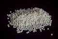 Top View of Closeup Pearls or white sago seeds balls On isolated Black Background