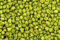 Top view closeup pile of dry crispy spicy wasabi coated green peas Royalty Free Stock Photo