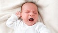 Top view closeup shot of newborn baby boy crying beacuse of feeling hungry Royalty Free Stock Photo