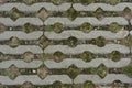 Top view closeup of stone pavement pattern with grass, moss and rocks in between Royalty Free Stock Photo