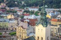 Top view closeup from town hall tower on old high catholic cathedral tower in Lviv city Royalty Free Stock Photo