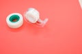 Top view closeup of a white duct tape and a tape dispenser isolated on a bright pink background Royalty Free Stock Photo