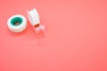 Top view closeup of a white duct tape and a tape dispenser isolated on a bright pink background Royalty Free Stock Photo