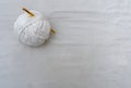 Top view closeup of a white t-shirt yarn ball with gold crochet hook isolated on white background Royalty Free Stock Photo