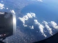 The top view of clouds and sky from an airplane window