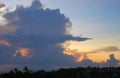 Top view of the coast, black silhouettes of roofs and palm trees, sunrise beautiful cloudy sky Royalty Free Stock Photo