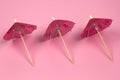 cocktail umbrellas pattern pink background Royalty Free Stock Photo