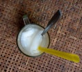 Top view of coconut fruit juice on vintage wooden table background. Unique cafe drink business concept.