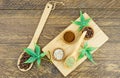 Top view of the coffee assortment in mini bowls and wooden spoons with connabis seeds and leaves. wooden brown background Royalty Free Stock Photo