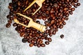 Top View.The coffee beans are in a brown burlap sack, laid on a black-gray ground, and with a wooden spoon to scoop the coffee Royalty Free Stock Photo