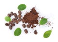 Top view of coffee beans with green leaf on white background Royalty Free Stock Photo