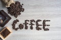Top view Coffee beans on wooden background in form of word of Royalty Free Stock Photo