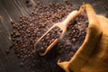 Top view of coffee beans in wooden spoon with smoke on pile of coffee beans Royalty Free Stock Photo