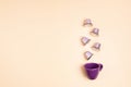 Top view of coffee capsules and cup over beige background with copy space. Morning dose of caffeine, energy, flavor