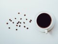 Top view coffee cup and beans on a white background. Morning coffee with grains flat lay concept Royalty Free Stock Photo