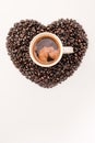 Top view of coffee in cup with heart made of coffee grains Royalty Free Stock Photo