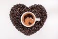 Top view of coffee in cup with heart made of coffee grains Royalty Free Stock Photo