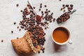 Top view of a coffee cup and coffee powder on a wooden spoon on white background. Coffee beans in the stainless steel scoop.Flat Royalty Free Stock Photo