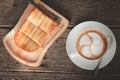 Top view of coffee latte on old wooden floor