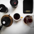 Top view of coffee making equipment with digital kitchen scales isolated on the white table Royalty Free Stock Photo