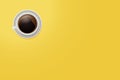 Top view of a coffee mug. Vector cup of coffee on a vivid yellow desktop background with copyspace.